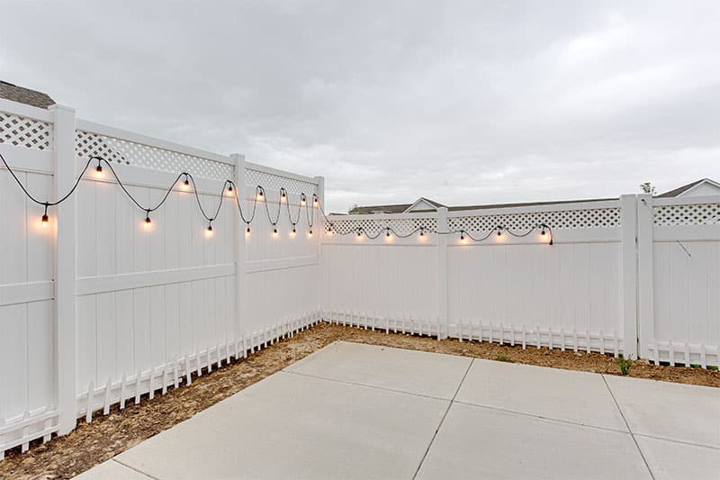 white vinyl fence with lights-AdobeStock_520391301